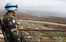UN peacekeeper overlooking valley