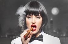 female manager smoking cigar