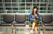 Young Asian woman waiting in airport