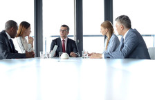 Group of business people having a discussion in a conference room