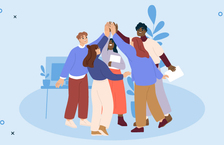 A team high-fiving and demonstrating a sense of good company culture