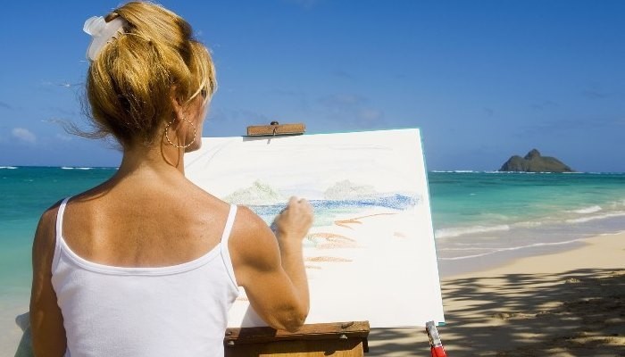 Woman Painting on Beach