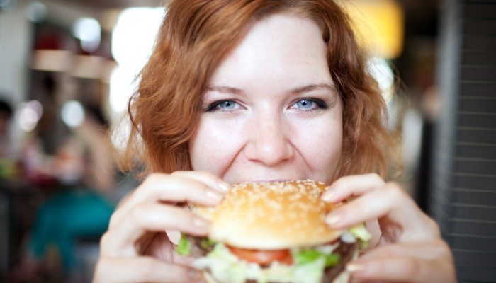 Girl eating burger