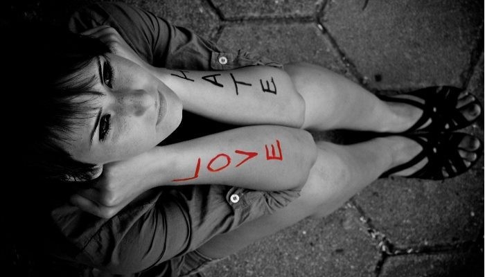 woman with love hate on arms