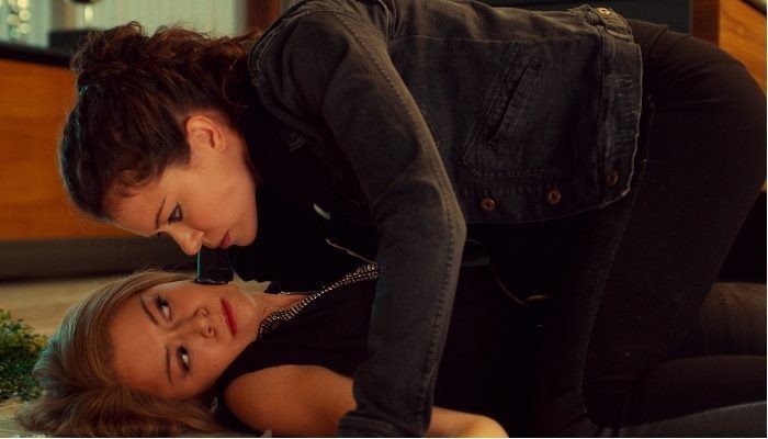 two women lying on each other