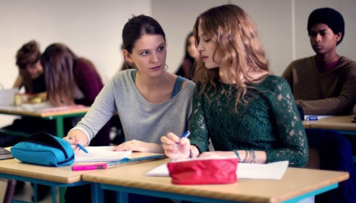 girls taking notes at class