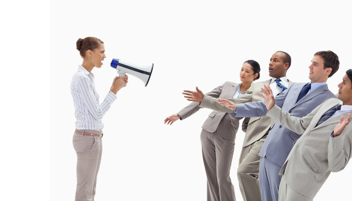 Woman yelling at people dressed in suits