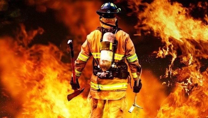 firefighter looking at flames