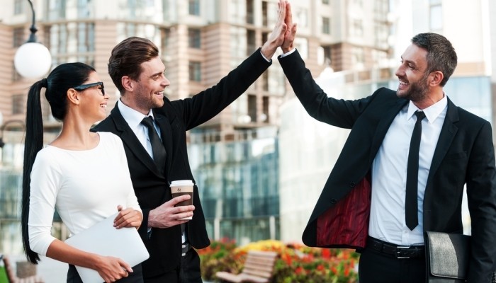 Two men high-fiving