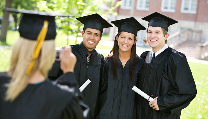Graduation Girl Takes Pictures Of Graduating Friends