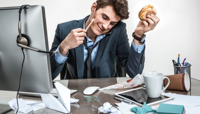 Office worker eating at desk
