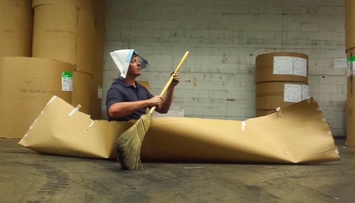 with the boat in the warehouse