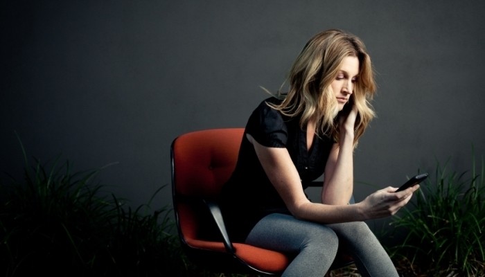woman looking at her phone