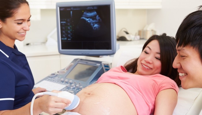 Couple having ultrasound scan