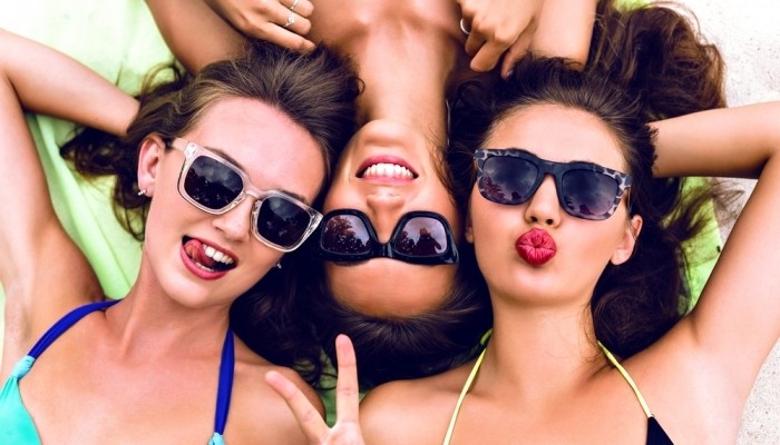 Girl friends relaxing in sun