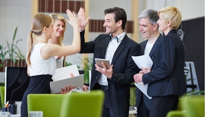 business people giving high five