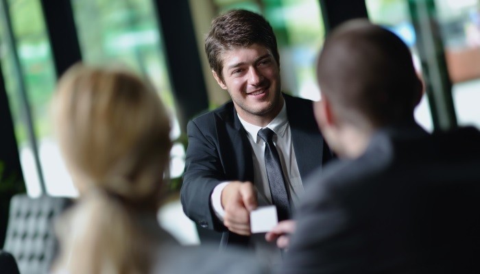 professional gives out his card