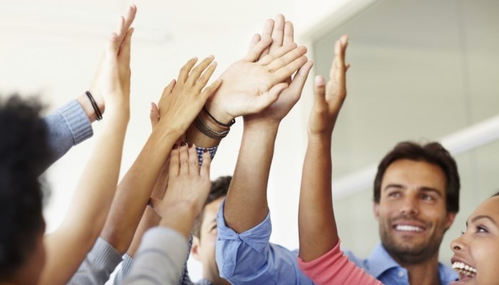 colleagues celebrating with high-five