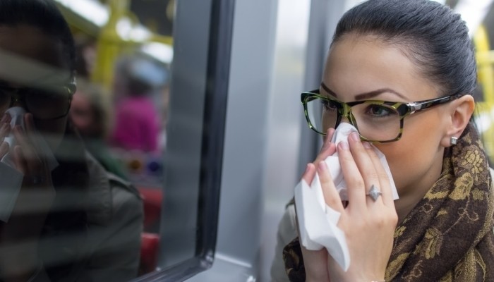Sick woman riding in public transport