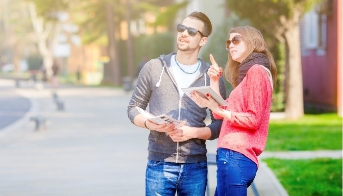 couple using a digital tablet to search