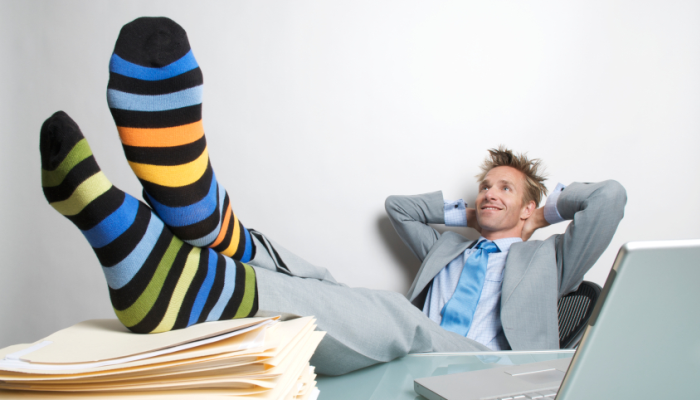 Businessman with feet on desk