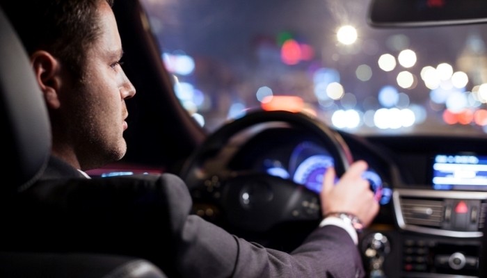 Businessman driving car