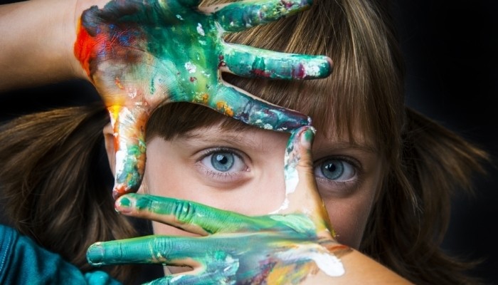 girl playing with colours