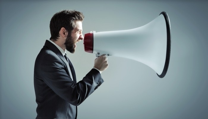 Businessman with large megaphone