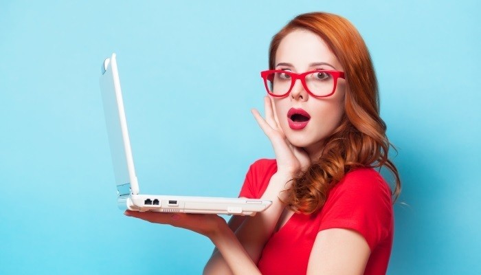 Shocked woman with laptop