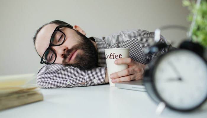 Office worker asleep at desk