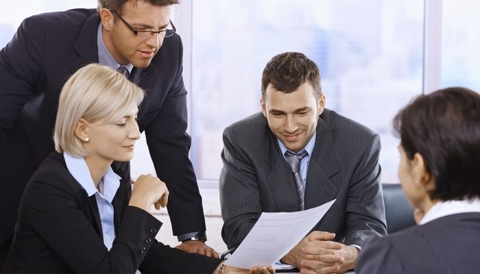 Business people reviewing document