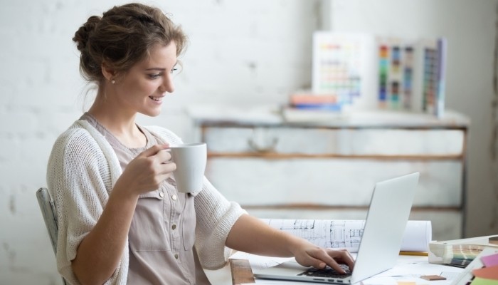 woman sitting at home office desk