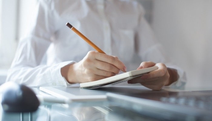 woman writing notes