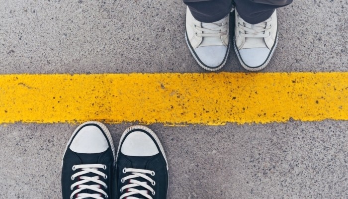 yellow line between people