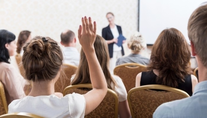 woman raising hand