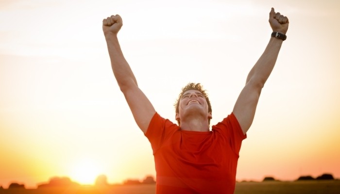 man raising hands