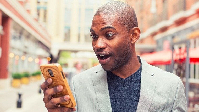 guy with mobile in shock