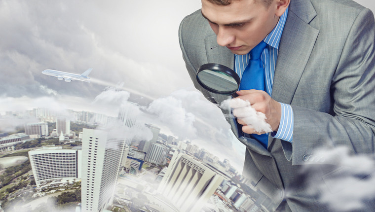 Businessman with magnifying glass