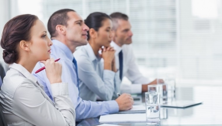 workers watching at presentation