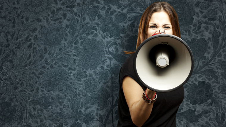Woman shouting in megaphone