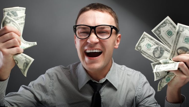 Greedy man holding money