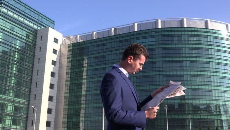 man reading newspaper