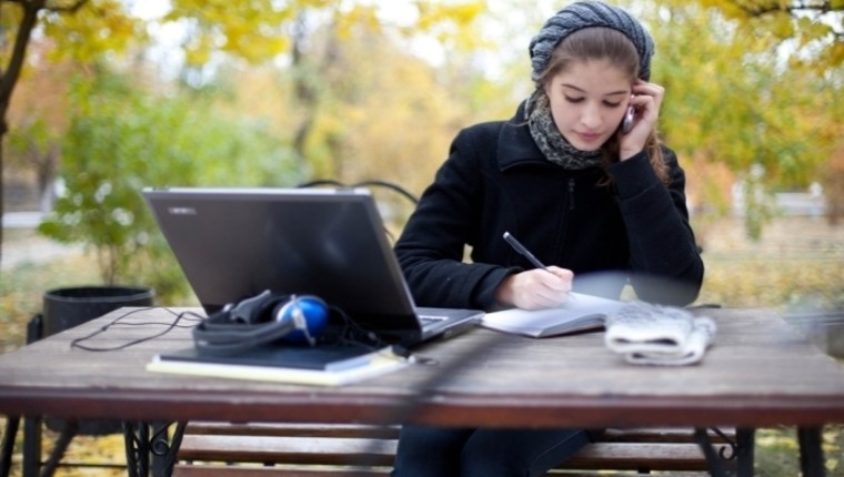 woman outside with laptop