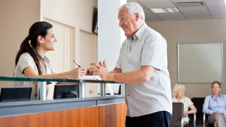 receptionist dealing with client