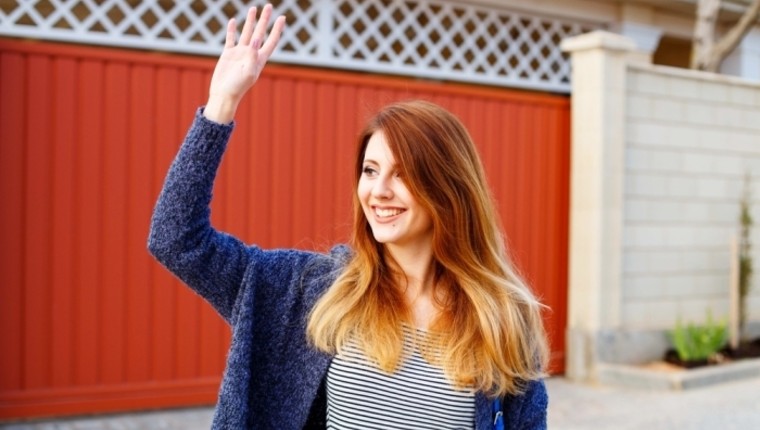 girl waving