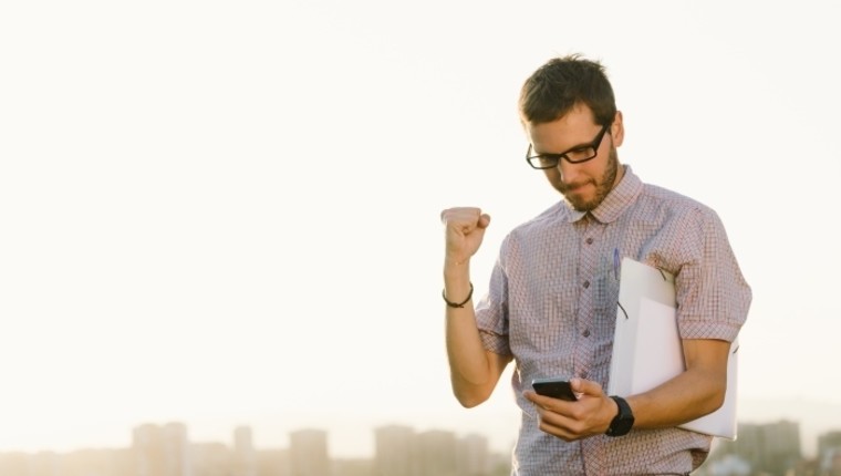 win, happy guy on phone