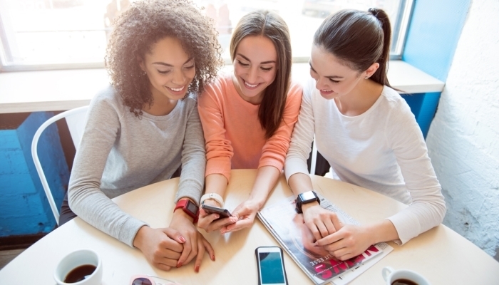 girls looking on mobile