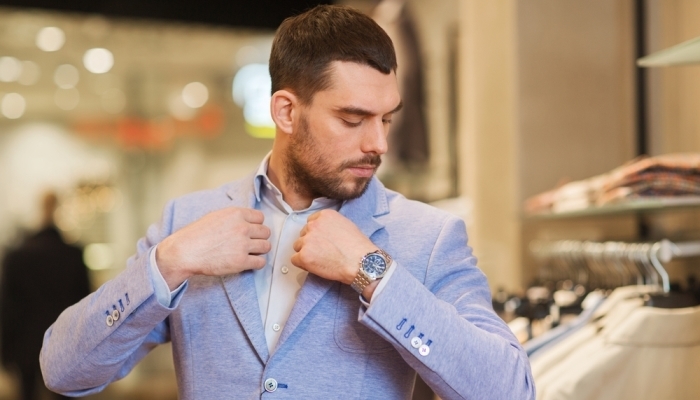 business person trying on suit