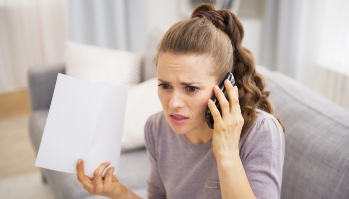 frustrated woman talking on the phone