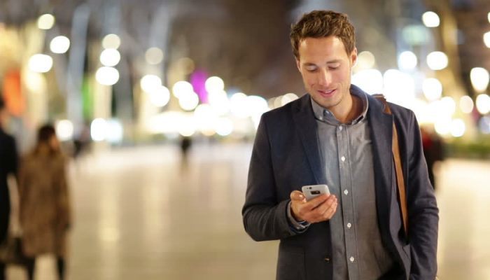 professional looking at phone
